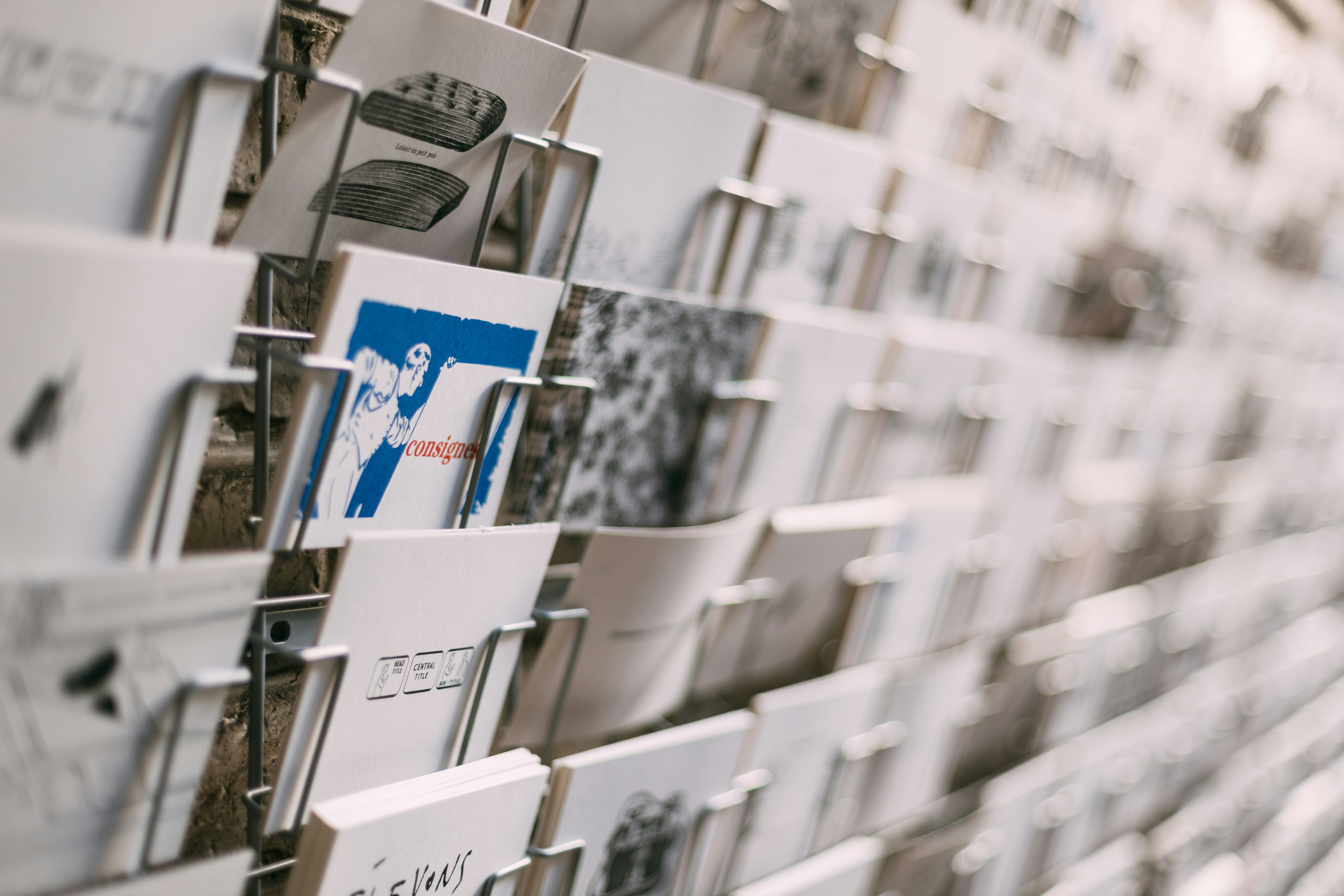 white and blue cards on glass shelf